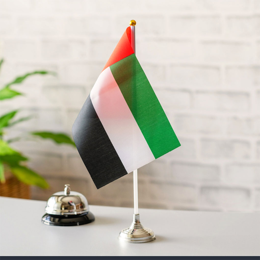 UAE table flag printing in Dubai with premium desk stand for offices hotels events and corporate displays